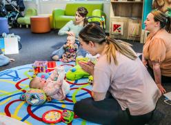 Babies sitting on a mat