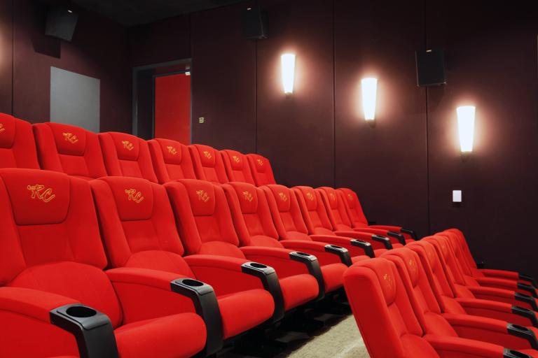 Image of the red chairs inside one of the cinema rooms