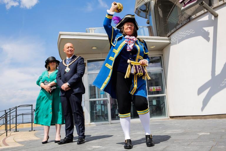 The Town Crier giving his Declaration next to the Redcar Beacon. Next to him there is the Mayor Stuart Smith and his wife.