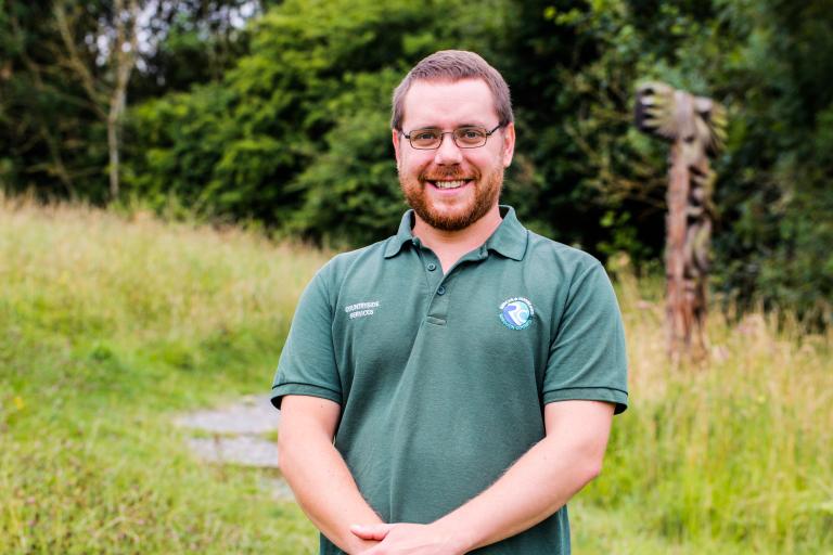 Image of park ranger Paul Bamber wearing a green polo shirt