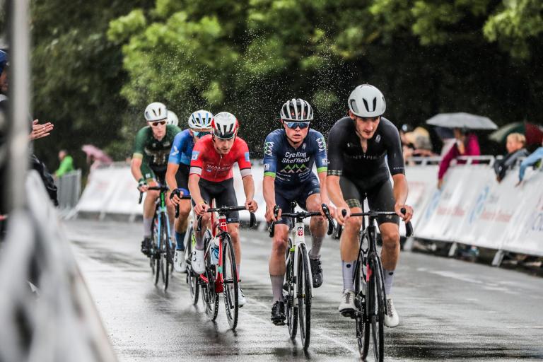 Cyclists speeding through rain at the Road Race.