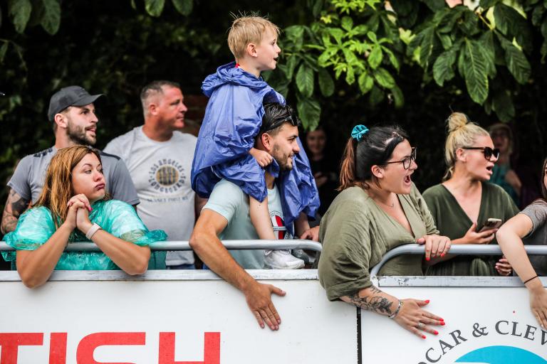 Crowds of people and children watching the Road Races