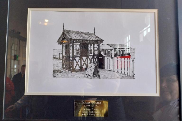 a picture representing a black and white dot portrait of the tramway and a man standing in front of it